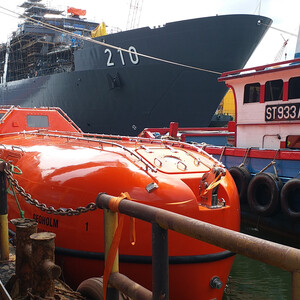 Totally enclosed lifeboat on water Totally enclosed lifeboat on water