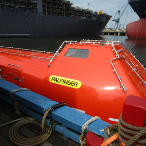 Totally enclosed lifeboat on water Totally enclosed lifeboat on water