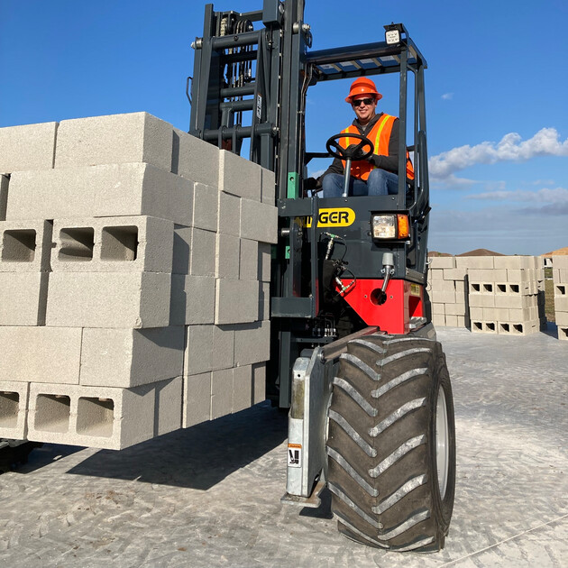 truck-mounted forklift lifting cement block pallet